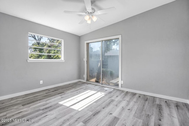 6903 Mayapple Rd, Jacksonville, FL 32211 - spare room featuring plenty of natural light, vaulted ceiling, wood finished floors, and a ceiling fan