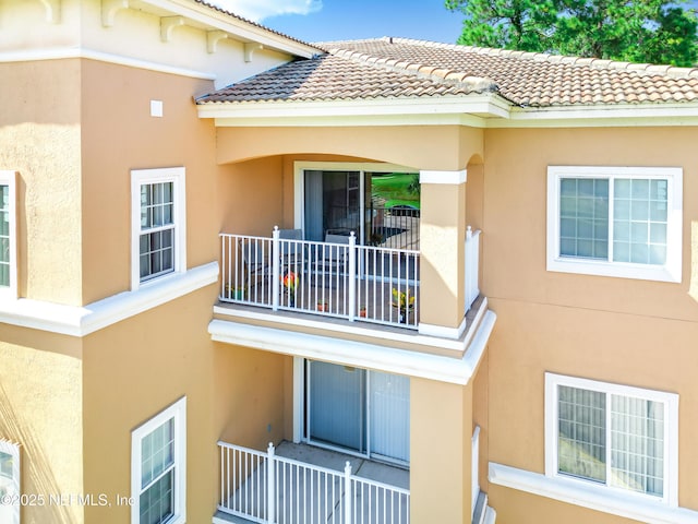 535 Florida Club Blvd Unit 307, Saint Augustine, FL 32084 - view of property exterior with a balcony, stucco siding, and a tiled roof