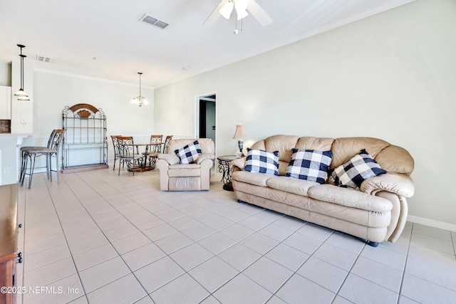 535 Florida Club Blvd Unit 307, Saint Augustine, FL 32084 - living room featuring light tile patterned floors, ornamental molding, a ceiling fan, and baseboards