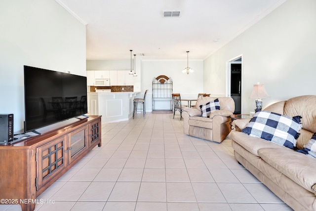 535 Florida Club Blvd Unit 307, Saint Augustine, FL 32084 - living room featuring crown molding and light tile patterned floors