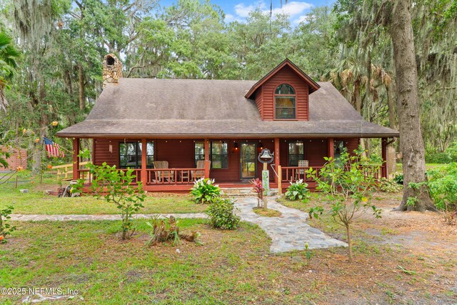 156 County Road 13, Saint Augustine, FL 32092 - view of front facade featuring a chimney and covered porch