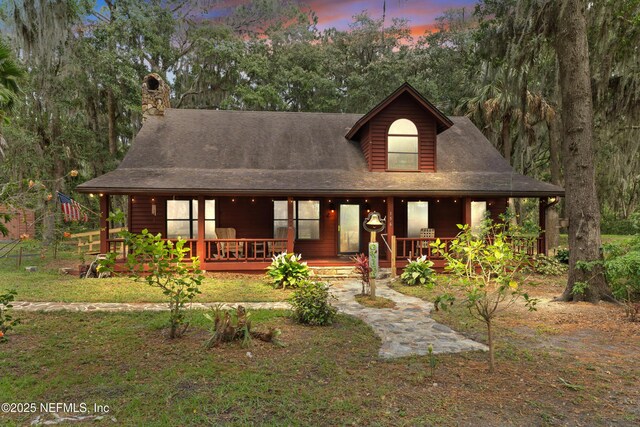 156 County Road 13, Saint Augustine, FL 32092 - view of front of home with a porch and a chimney