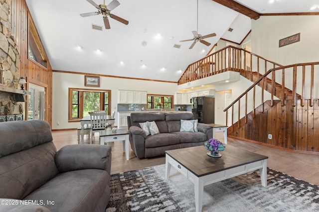 156 County Road 13, Saint Augustine, FL 32092 - living area with a ceiling fan, high vaulted ceiling, light wood-type flooring, stairway, and beam ceiling