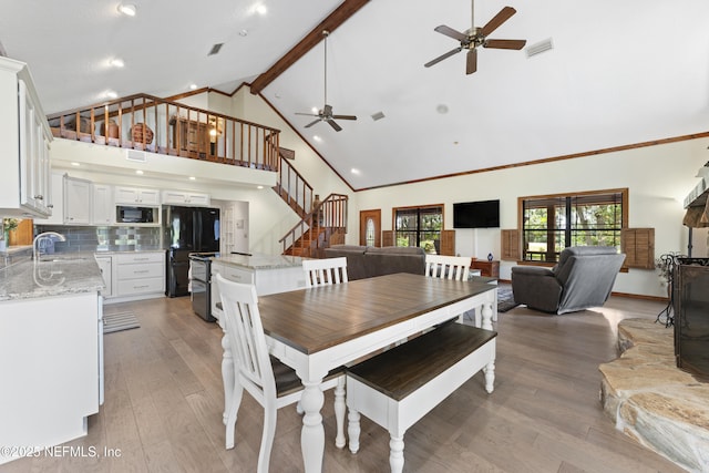 156 County Road 13, Saint Augustine, FL 32092 - dining room with ceiling fan, high vaulted ceiling, stairway, light wood-style flooring, and beamed ceiling