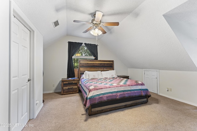 156 County Road 13, Saint Augustine, FL 32092 - carpeted bedroom with a textured ceiling, vaulted ceiling, baseboards, and a ceiling fan