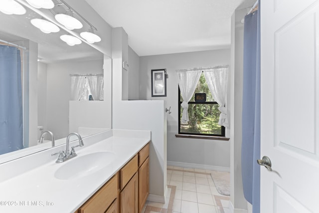 156 County Road 13, Saint Augustine, FL 32092 - bathroom featuring vanity, tile patterned flooring, and baseboards