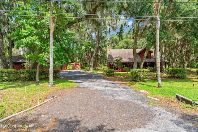 156 County Road 13, Saint Augustine, FL 32092 - view of front of property featuring a chimney, a front lawn, and driveway