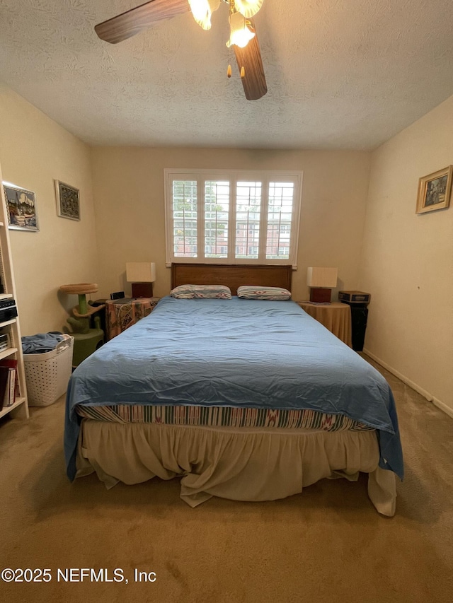 4915 Baymeadows Rd Unit 11E, Jacksonville, FL 32217 - bedroom featuring carpet, a textured ceiling, and a ceiling fan