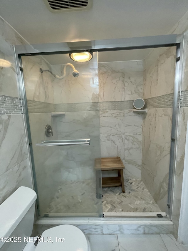 4915 Baymeadows Rd Unit 11E, Jacksonville, FL 32217 - bathroom featuring a marble finish shower and marble finish flooring