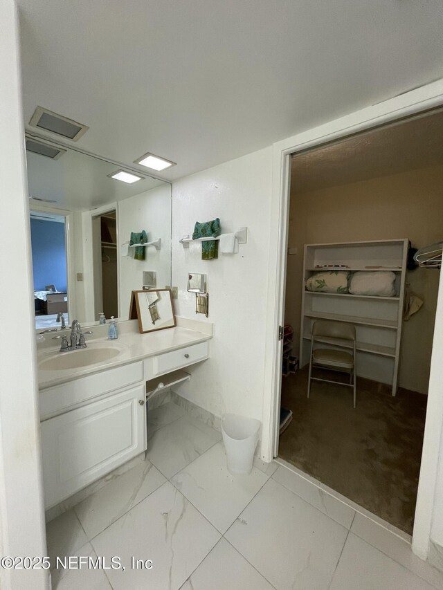 4915 Baymeadows Rd Unit 11E, Jacksonville, FL 32217 - bathroom with vanity and marble finish flooring