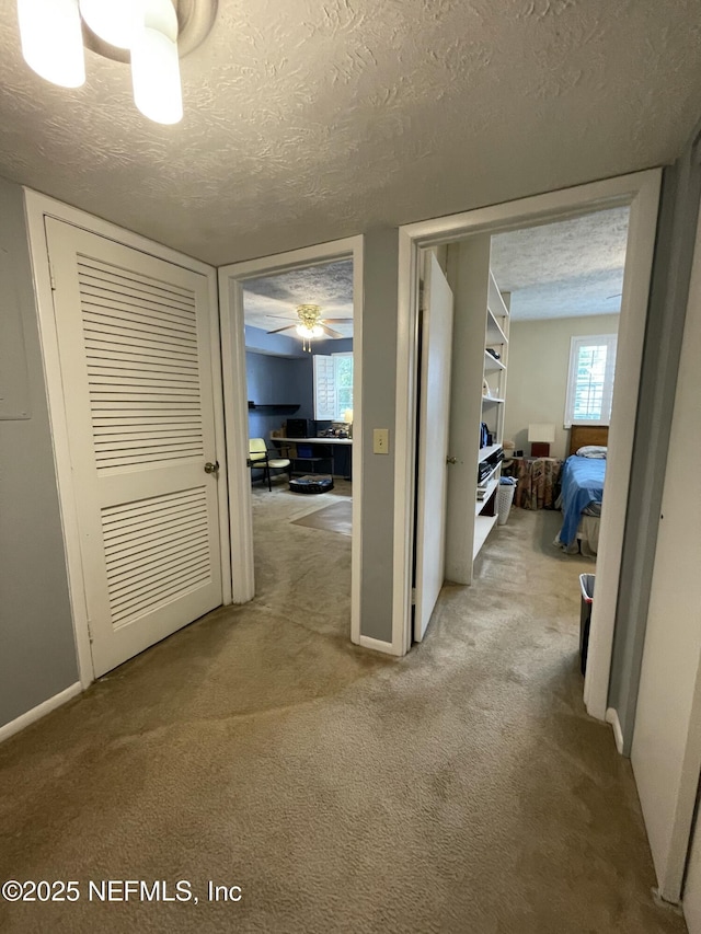 4915 Baymeadows Rd Unit 11E, Jacksonville, FL 32217 - hall featuring carpet floors and a textured ceiling