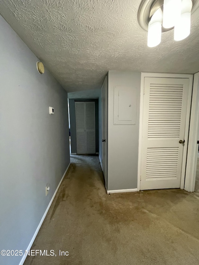 4915 Baymeadows Rd Unit 11E, Jacksonville, FL 32217 - hallway with carpet and a textured ceiling