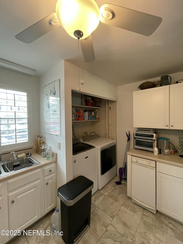 4915 Baymeadows Rd Unit 11E, Jacksonville, FL 32217 - kitchen with independent washer and dryer, white dishwasher, white cabinetry, and light countertops