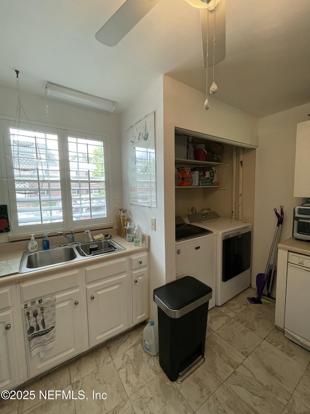 4915 Baymeadows Rd Unit 11E, Jacksonville, FL 32217 - kitchen featuring washing machine and dryer, white cabinets, light marble finish flooring, light countertops, and a ceiling fan