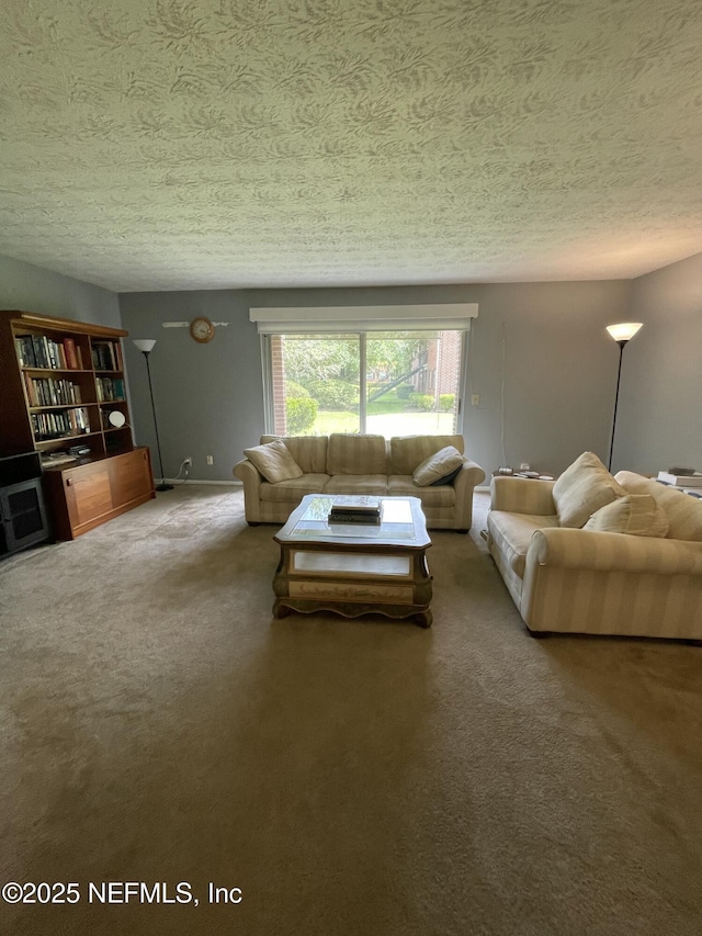4915 Baymeadows Rd Unit 11E, Jacksonville, FL 32217 - carpeted living room featuring a textured ceiling