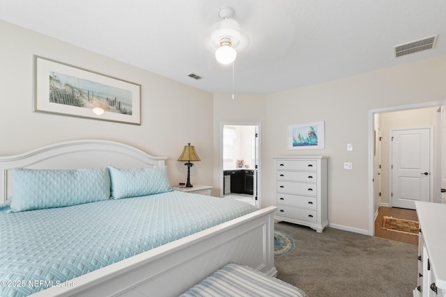 85464 Amaryllis Ct, Fernandina Beach, FL 32034 - bedroom featuring dark carpet, baseboards, and ensuite bathroom