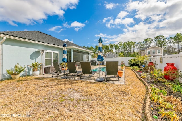 85464 Amaryllis Ct, Fernandina Beach, FL 32034 - fenced backyard featuring a patio and a sunroom