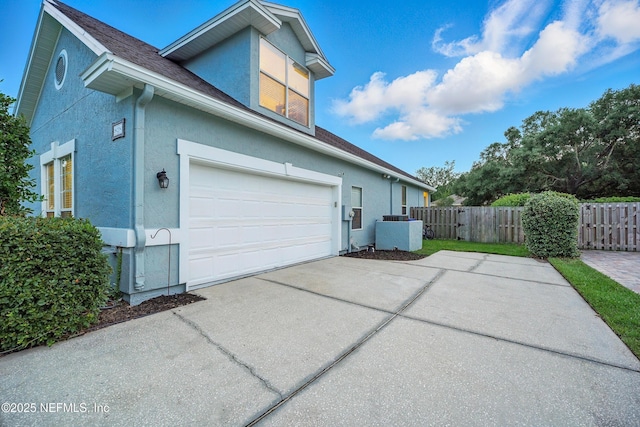 828 Lotus Ln N, Saint Johns, FL 32259 - view of property exterior with stucco siding and concrete driveway
