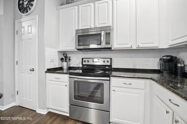 828 Lotus Ln N, Saint Johns, FL 32259 - kitchen featuring stainless steel appliances, dark wood-style flooring, white cabinets, and backsplash