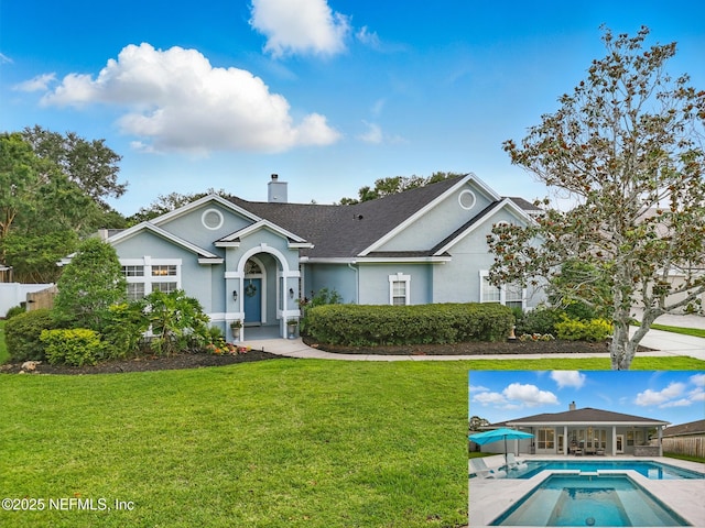 828 Lotus Ln N, Saint Johns, FL 32259 - single story home with a front yard, a chimney, stucco siding, and a patio