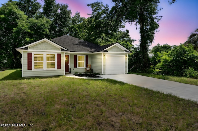 127 Azalea Cir, Palatka, FL 32177 - ranch-style home featuring a garage, driveway, a front yard, and roof with shingles