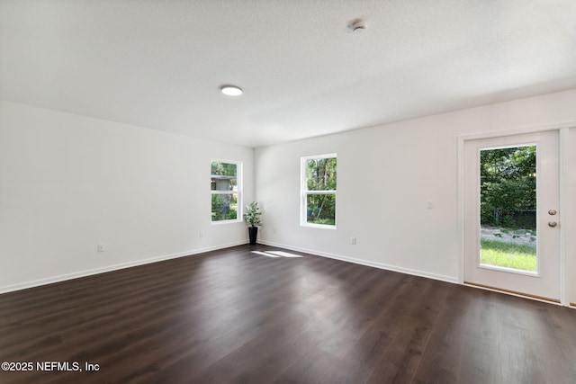 127 Azalea Cir, Palatka, FL 32177 - spare room with dark wood-type flooring, baseboards, and a smoke detector