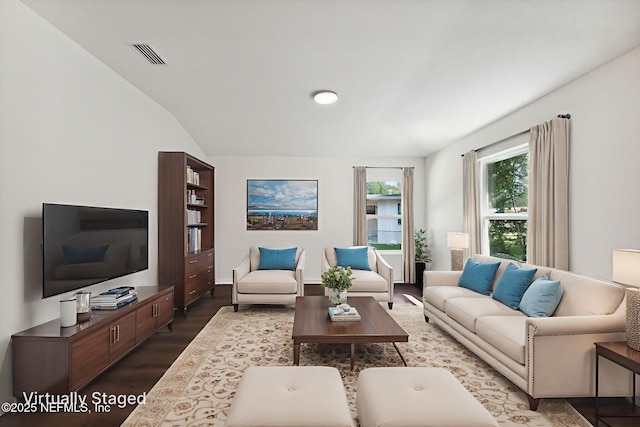 127 Azalea Cir, Palatka, FL 32177 - living area featuring wood finished floors and vaulted ceiling