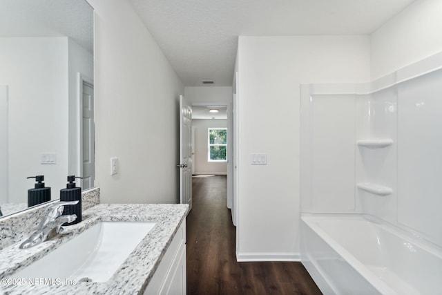 127 Azalea Cir, Palatka, FL 32177 - bathroom with wood finished floors, vanity, shower / bathtub combination, and baseboards
