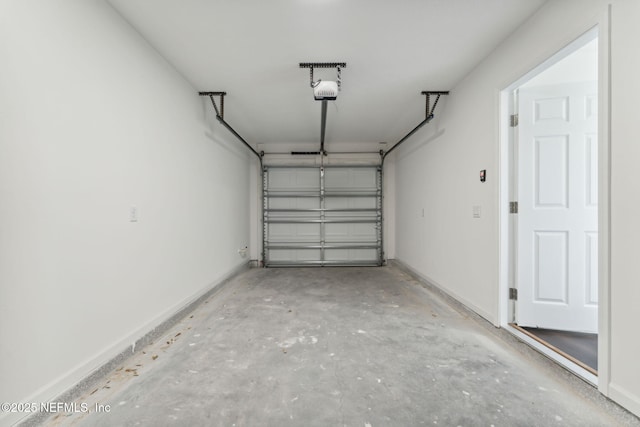 127 Azalea Cir, Palatka, FL 32177 - garage featuring a garage door opener and baseboards