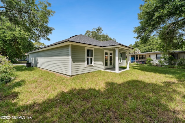 127 Azalea Cir, Palatka, FL 32177 - rear view of house with a lawn, french doors, central AC unit, and a patio