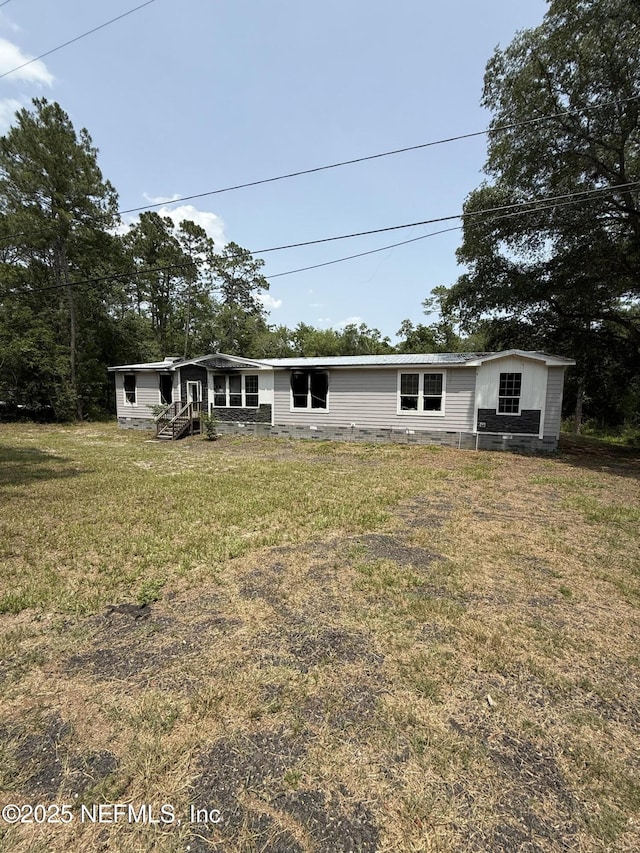 74 Conifer Cir, Middleburg, FL 32068 - manufactured / mobile home with a front lawn