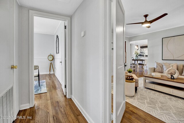 3741 Orlando Cir E, Jacksonville, FL 32207 - hallway featuring wood finished floors, crown molding, and baseboards
