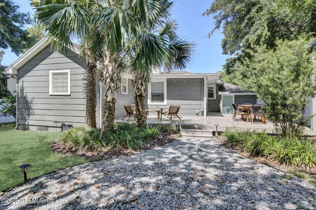 3741 Orlando Cir E, Jacksonville, FL 32207 - view of front facade featuring a wooden deck and a front yard