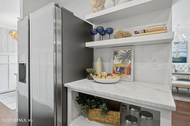 53 Waterbridge Pl, Ponte Vedra Beach, FL 32082 - detailed view of stainless steel fridge, wood finished floors, and decorative backsplash