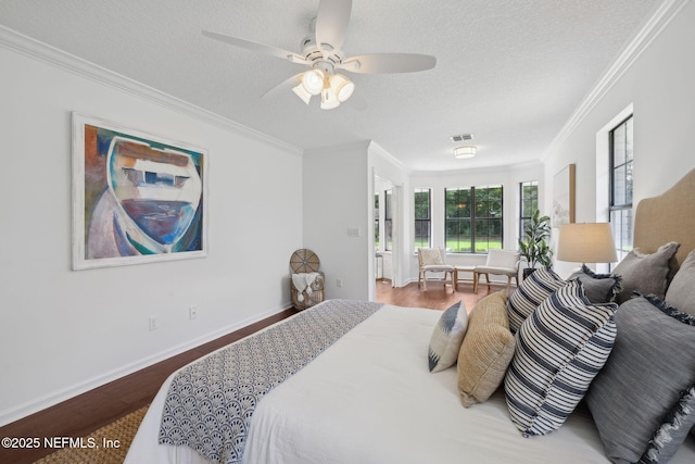 53 Waterbridge Pl, Ponte Vedra Beach, FL 32082 - bedroom featuring crown molding, wood finished floors, a textured ceiling, a ceiling fan, and baseboards