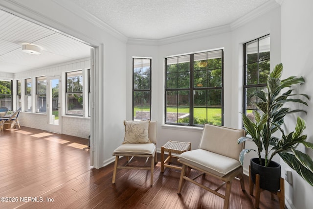 53 Waterbridge Pl, Ponte Vedra Beach, FL 32082 - sunroom / solarium with wood-type flooring, plenty of natural light, a textured ceiling, and crown molding