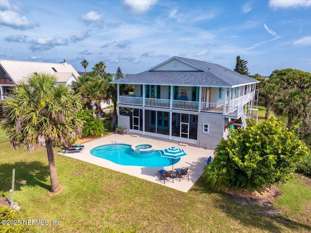 231 Barrataria Dr, Saint Augustine, FL 32080 - rear view of property featuring a balcony, a patio area, a yard, and stucco siding