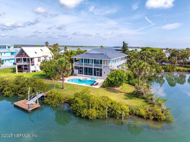 231 Barrataria Dr, Saint Augustine, FL 32080 - rear view of house featuring a yard, a balcony, an outdoor pool, and a water view