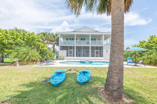 231 Barrataria Dr, Saint Augustine, FL 32080 - rear view of property with a balcony, a yard, and a patio area