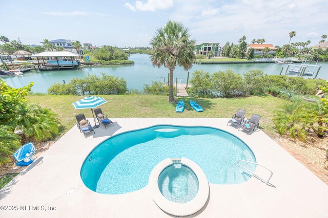 231 Barrataria Dr, Saint Augustine, FL 32080 - view of swimming pool featuring a yard, a pool with connected hot tub, and a water view