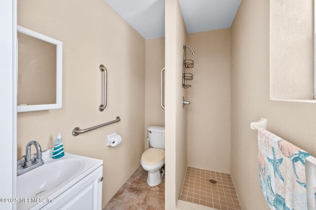 231 Barrataria Dr, Saint Augustine, FL 32080 - bathroom with toilet, vanity, a shower, and tile patterned floors