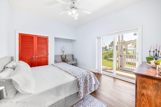 231 Barrataria Dr, Saint Augustine, FL 32080 - bedroom featuring wood finished floors, access to exterior, baseboards, a ceiling fan, and a closet