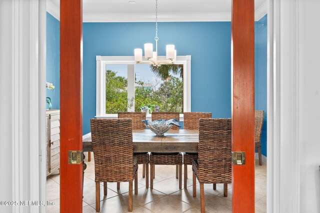 231 Barrataria Dr, Saint Augustine, FL 32080 - dining area with a chandelier, crown molding, baseboards, and tile patterned flooring