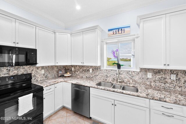 231 Barrataria Dr, Saint Augustine, FL 32080 - kitchen with black appliances, a sink, decorative backsplash, ornamental molding, and white cabinets