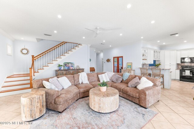 231 Barrataria Dr, Saint Augustine, FL 32080 - living room with stairs, light tile patterned flooring, recessed lighting, ornamental molding, and ceiling fan