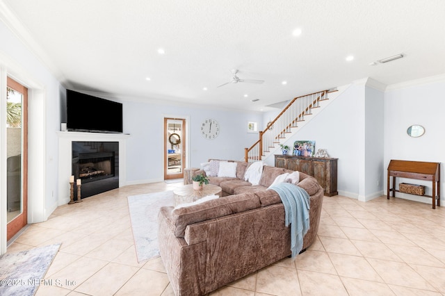 231 Barrataria Dr, Saint Augustine, FL 32080 - living room with ornamental molding, stairs, light tile patterned floors, ceiling fan, and recessed lighting