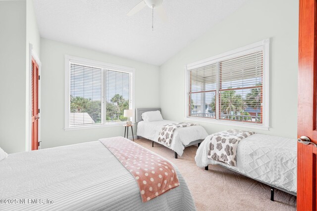 231 Barrataria Dr, Saint Augustine, FL 32080 - carpeted bedroom featuring vaulted ceiling and ceiling fan