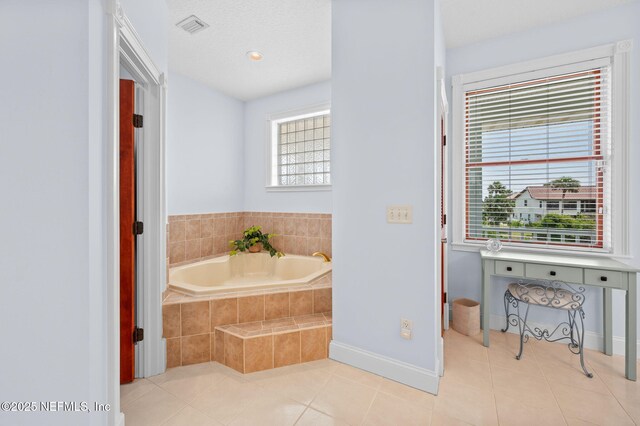 231 Barrataria Dr, Saint Augustine, FL 32080 - full bathroom featuring a garden tub, tile patterned flooring, and baseboards