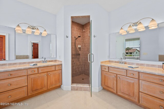 231 Barrataria Dr, Saint Augustine, FL 32080 - full bath featuring a shower stall, vanity, tile patterned floors, and baseboards