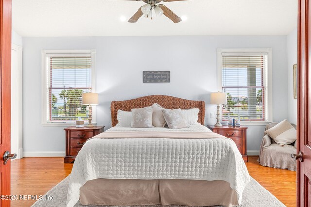 231 Barrataria Dr, Saint Augustine, FL 32080 - bedroom with light wood-style floors, baseboards, and ceiling fan